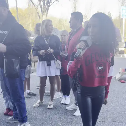 Looping clip: Chelsea on the mic hyping the crowd at the Mercedes-Benz of Athens game day watch party
