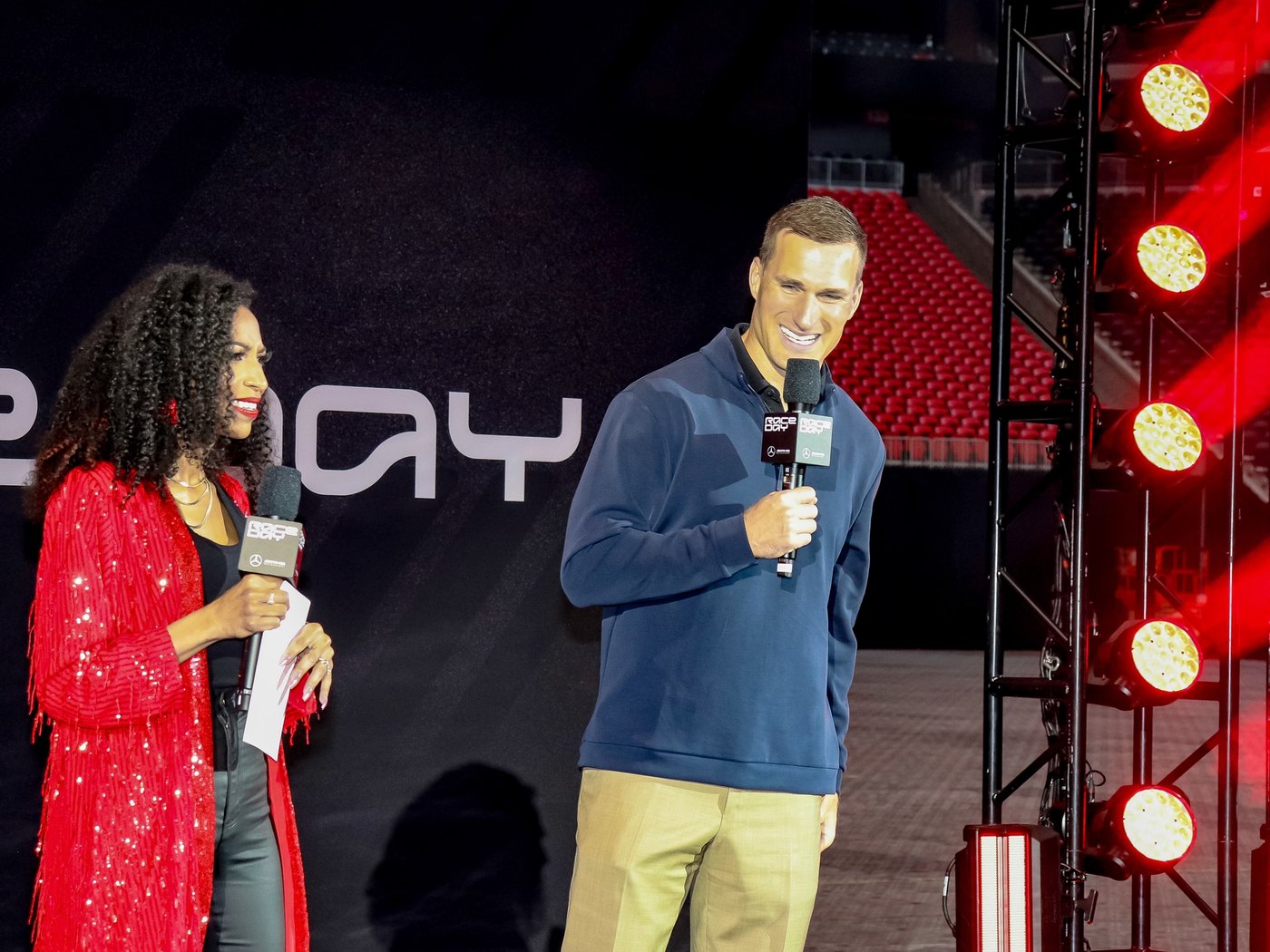 Chelsea interviewing Kirk Cousins on stage at Mercedes-Benz AMG Race Day